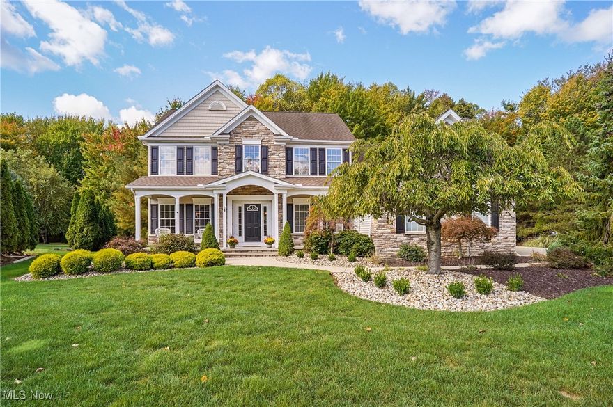 Welcome to this exquisite 4 bdrm, 3.5 bath Colonial in the prestigious Ellison Creek development of Concord Township. Beautifully landscaped lot surrounded by mature trees, this home blends timeless architectural design w/luxurious finishes w/ 3-car garage, front porch & manicured curb appeal. Grand foyer w/HDWD floors & elegant millwork that flow throughout the main level. The heart of the home is the spectacular gourmet kitchen featuring a lrg granite island w/gas range, breakfast bar, double ovens, rich wood cabinetry w/cozy gas FP perfect for family gatherings or coffee by the fire. The kitchen opens seamlessly to the impressive great room, where a beautiful stone wood burning fireplace, surround sound, and a gorgeous wall of windows allows in natural light & breathtaking views of the private wooded yard. Sliding glass doors lead out to a large composite deck & patio. Formal DR features crown molding, wainscoting & an arched entryway, while a separate front office w/double French doors provides a quiet & stylish workspace. Laundry room off the garage includes built-in cabinets, a sink & storage. Upstairs, the luxurious primary suite is a peaceful retreat w/spacious sitting area, WIC & a spa-inspired ensuite bath showcasing dual vanities, soaking tub & a separate shower. Three additional bdrms & a FB complete the spacious upper level. Finished lower level offers exceptional living space w/ stylish bar area, versatile recreation & living space, FB & a large storage room. Recent updates include a new HVAC system w/Aprilaire & filtration 2024 & HWT 2025. The home is also equipped with a natural gas hookup, CAT 5 cable wired throughout & surround sound on the main & lower level. Outdoor living is equally impressive with a large composite deck & stamped concrete patio overlooking a wooded backdrop. Every detail in this home reflects comfort, sophistication, and quality craftsmanship offering a truly luxurious lifestyle in one of Concord's most coveted neighborhoods.