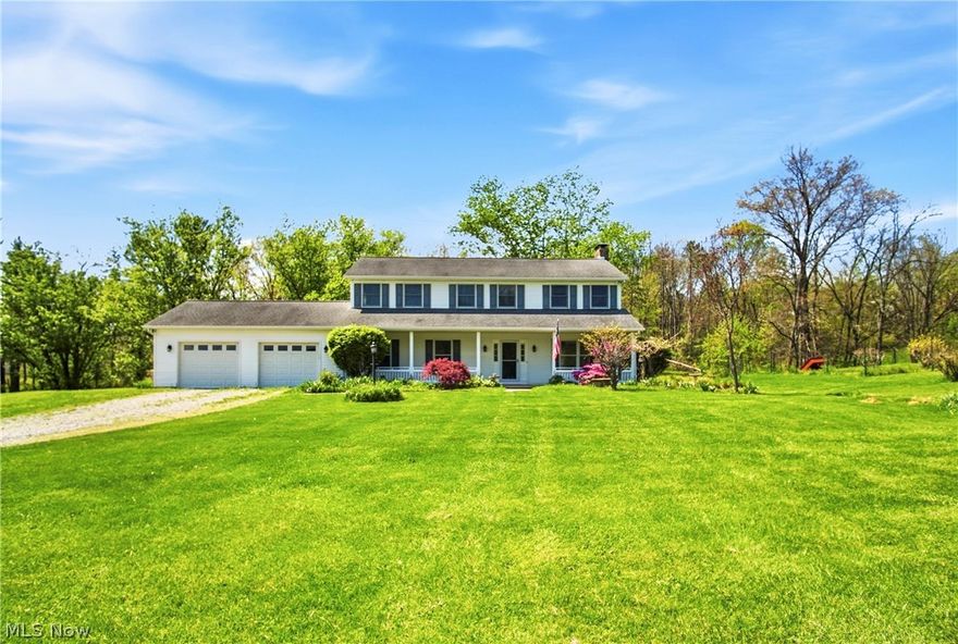 Room to live, grow, and truly enjoy country living--this spacious, one-owner home in the Tri-Valley LSD is being offered to the market for the very first time! Custom built in 1995 and meticulously maintained, this 6 bedroom, 2 full baths & (2) 1/2 baths property sits on 2.08 acres and offers the space and features today's buyers are looking for! Start your mornings on the covered front porch with a coffee on the swing, or unwind out back, watching the sunset, on the deck featuring all new flooring boards. A side concrete patio provides the perfect setup for a future hot tub. Inside, the kitchen is equipped with stainless steel appliances, Corian countertops, and beautiful cherry cabinetry, along with an abundance of storage throughout the home. A main floor bedroom offers flexibility for a home office or guest space, while the large first-floor laundry/mudroom adds everyday convenience right off the garage. The lower level includes walk-out access, a fruit cellar/tornado room, and a half bath with potential to add a shower--ready to be finished to your liking for additional living space. Stay comfortable year-round with an efficient geothermal heating and cooling system, plus enjoy the charm of a custom-built brick, wood-burning fireplace and an additional wood stove for supplemental heat.
Outdoors, you'll find a fenced garden area, blueberry bushes, and apple trees--perfect for those who love to garden or simply enjoy the outdoors. The home has also been recently power washed and is truly move-in ready. Immediate possession available! Move in before summer and the next school year too!