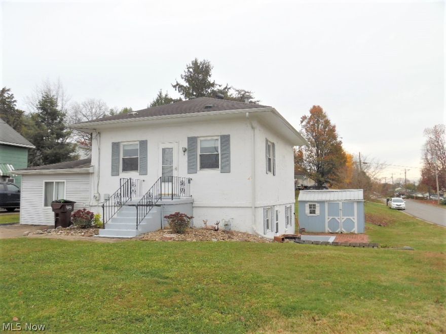 What a cutie!!  This all concrete home on Harmar Hill is not your average layout!!  Main level has a good sized living room, two bedrooms and full bath.  Then downstairs- about halfway above ground with plenty of windows and natural light and walk-out to a nice sunken patio and brick patio is where you find the kitchen, dining room, family room, laundry and half bath.  Then, a short flight of stairs leads you to the recreation room where we believe was a garage!  GFA/CAC in the main house, and wall AC unit in the rec room, but no heat there.  The lower level rooms all have nice ceramic tile floors and the main level is carpeted.  A great big backyard and storage building complete the picture!!

CENTRAL AIR CONDITIONING DOES NOT WORK.
OFFERS WILL BE ACCEPTED UNTIL 5:00 P.M. SUNDAY, NOV. 6 AND SELLERS WILL DECIDE ON MONDAY NOV. 7.