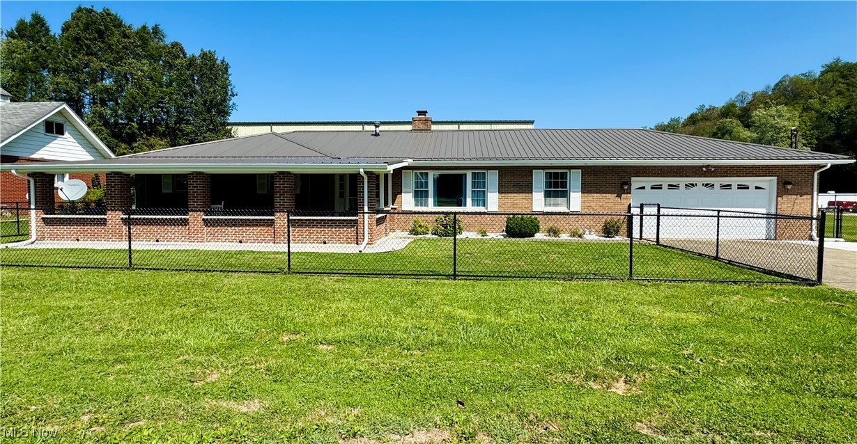 Home for sale in Sistersville area, Brick ranch consisting of 6 rooms,two baths and utility room,double ,oversized garage ,large front covered porch and back covered deck. Also, storage/workshop ,large fenced double lot and large garden. Home offers inviting approach with large new covered porch and beautiful entry doors. The entry opens to the right to a formal living room and the to the formal dining room. The eat-in kitchen offers multiple cabinets and counter space and is open to the family room. The wood burning fireplace adds warmth and comfort and glass doors offer outdoor views and light. There are 3 comfortable sized bedrooms with a full bath with back bedroom . A utility room is just off the kitchen. The property has an expanded driveway for additional parking. There is an existing Kohler Generator. List of info and upgrades available. This home is immaculate ,comfortable and very well kept. Make an appointment to see today!