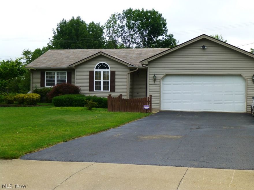 Columbiana - spacious 3 bedroom, 3 bath ranch located in the desirable Cimarron development.  The entry way opens to a bright and cheery living room which features a vaulted ceiling, ceiling fan and gas fireplace.  The eat in kitchen offers a 10 x 11 dining area, access to the 2 car attached garage, and the convenience of a first floor laundry closet!  The master bedroom offers a master bath, separate vanity area, and a walk in closet.  Two sets of french doors open to a rear deck which overlook a vinyl fenced in yard featuring a small pond and shed.  There is plenty of storage space available in the basement which has one finished room and a bath.  The possibilities are endless, this one won't last long!