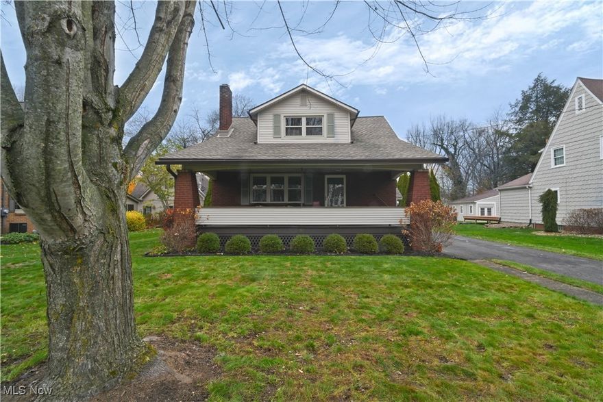 Welcome to 50 College Street, a beautifully maintained two story brick home filled with classic charm and everyday comfort. The large covered front porch sets a welcoming tone the moment you arrive, and stepping inside reveals warm hardwood floors, original trim, and a layout that feels both inviting and surprisingly spacious. The living room offers generous natural light and an easy flow into the dining room, creating a setting that works well for relaxed evenings or the kind of casual gatherings that make a house feel alive. The kitchen provides plenty of room for everyday function and has a comfortable, practical feel that suits both quiet mornings and busy routines. Two bedrooms and a full bath on the first floor offer flexibility that fits a variety of lifestyles, whether you want the convenience of main level living or prefer space for guests or a home office. The second floor features two additional bedrooms along with a refreshed half bath, and the dormer style rooms feel larger than expected with new carpet, generous storage nooks, and a layout that works well for bedrooms, study areas, or a comfortable retreat at the end of the day. The basement is clean and functional with updated electrical service and ample storage options that help keep life organized. The property also includes a two car detached garage and a manageable lot that offers space without demanding extensive upkeep. Fresh paint and clean finishes throughout make this home truly move in ready and simple to picture as your next chapter.