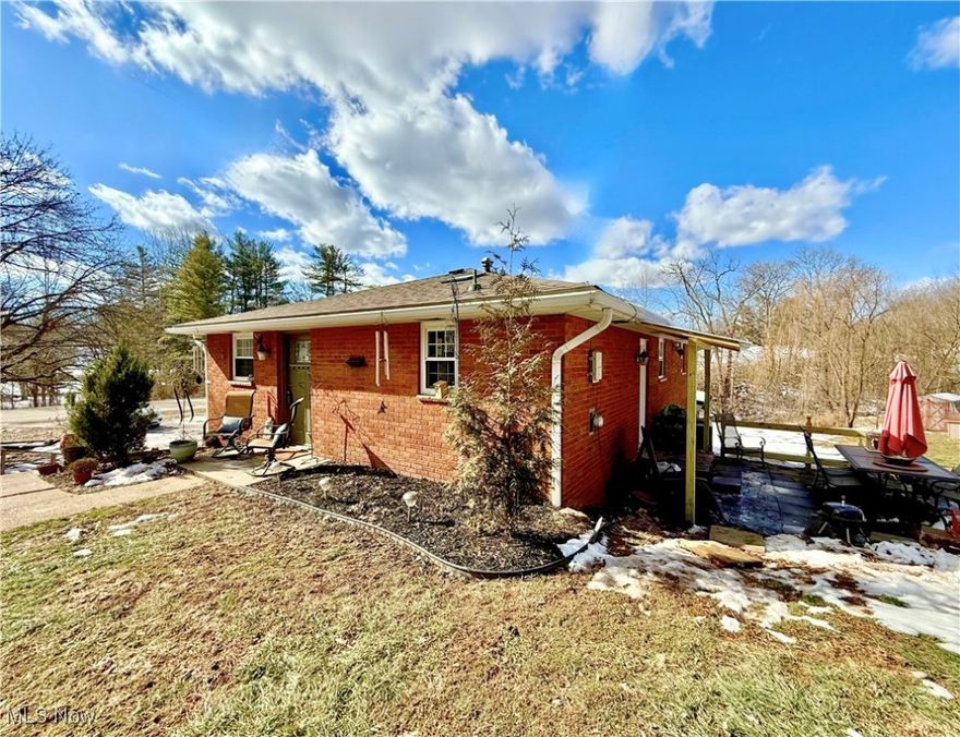 *NOT IN A FLOOD ZONE* This beautiful brick RANCH has it all, including a MOTIVATED SELLER! Situated on a spacious corner lot of nearly an acre, this home offers both comfort and versatility, all just minutes from every amenity you could need—shopping, dining, schools, and more. You’ll love the attached garage for easy parking, plus the added convenience of a carport. The large field is perfect for creating your dream garden, and the property even includes fruit trees to help you get started. Inside, you'll find a blend of modern updates and timeless character, including original hardwood floors, neutral paint, bay window, stainless appliances, and all of the extra touches that give this home its warm, inviting feel. With two full baths, an adorable eat-in kitchen, and the potential for four bedrooms, this home has room for everyone. The lower level has all the makings of a fabulous primary suite with a full bath, sitting area, laundry, and kitchenette. And here’s another bonus: the seller states the property is zoned mixed use, opening up a variety of possibilities! Especially once you throw in the 24x18 detached garage that comes equipped with a wood burner and electricity. This space is ideal for a workshop, studio, or extra storage. You can't afford to wait—schedule your tour today before it’s gone!