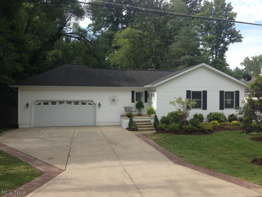 Completely Updated Ranch with finished walk out lower level.  This home features Newer landscaping, hardwood floors throughout, freshly pained throughout, and newer stainless appliances.  Two story greatroom -dining room, Master bedroom has custom built ins french doors leading to a large deck.  The second bedroom on the first floor has a wall of closets!!!  Lots of storage.  Both bathrooms have been updated with new fixtures.  A great Kitchen that features all newer luxury appliances.  The walk out lower level has a large laundry room with tons of storage. state of the art washer and dryer, and  a large family room.  The third bedroom is in the lower level with a  large brick patio and   full bath.  An extra large back yard features a wonderful fire pit.  Great for entertaining.  This home has a oversized two car garage with a pull down attack.  Forced air/Air conditioning.  Absolutely immaculate.  Walking distance to Village.