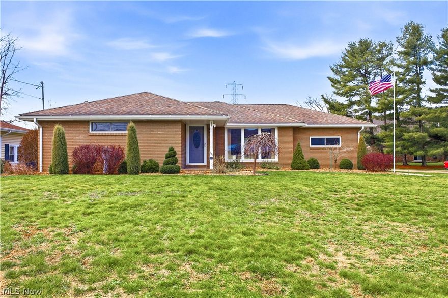 Pack your bags and fall in love with this fully remodeled brick ranch in Wellsville, perfectly situated on a beautifully landscaped corner lot! This 3-bedroom, 1.5-bath home with a 1-car attached garage featuring Nature Stone flooring is truly move-in ready. Step into the bright and airy living room, with a wall of windows, allowing for an abundance of natural light to show off the decorative beamed ceilings, refinished hardwood floors, and crown molding.  Enjoy movie nights with the included projection TV, screen, and custom-built shelving. The eat-in kitchen has been completely updated with granite countertops, soft-close cabinets and drawers, a pot filler, LVT flooring, and recessed lighting. The appliances (stove, refrigerator, dishwasher, microwave) are under 1 year old. All three bedrooms offer refinished hardwood floors and double closets. The full bath completes the main level and has been updated within the last 3 years with a new tub, toilet, sink, LVT flooring, and porcelain surround. The finished basement expands your living space with a family room featuring a decorative fireplace, a rec area, and a convenient laundry room with automatic lighting. Sliding glass doors lead to a back patio perfect for entertaining, along with a 10x20 shed for additional storage. Conveniently located near a local park. Don’t miss this one—style, updates, and comfort all wrapped into one beautiful home. Call today!