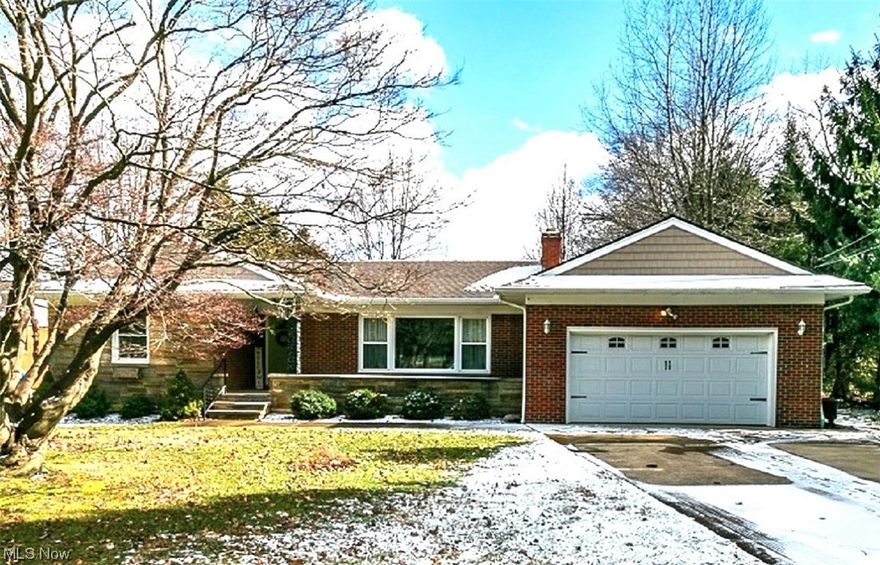 Sharp brick and stone Ranch with many updates throughout.  Newer eat-in kitchen with breakfast bar, granite counters, wood cabinets, stainless steel appliances, hardwood floors and a dining area with access to the patio overlooking the large 1+ acre wooded lot. Convenient mud room area with a built bench, hooks and storage.  Spacious living room with fireplace and hardwood floors.  Updated baths with granite counters.  Hardwood floors throughout.  Newer vinyl windows.  Easy and accessible walk up attic. 
Finished lower level with Recreation room with fireplace, bonus room/play room, office and storage area.  Glass block windows.  
Large shed for storage. Mins from I-271 & I-90, 20 mins to downtown Cleveland & close to business & medical communities, dining, shopping & schools. Award winning Mayfield schools. Wonderful​​‌​​​​‌​‌​​​‌‌​​​‌‌‌​​‌​​‌‌​​​​ opportunity!