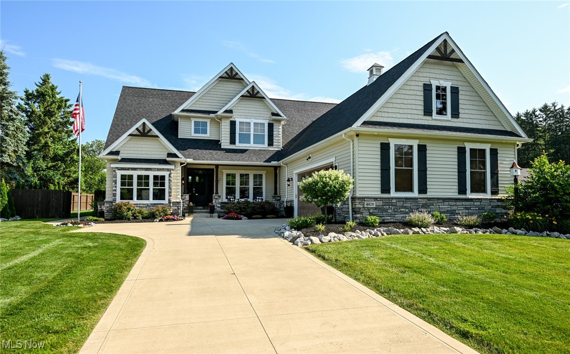Discover the charm of this thoughtfully designed, multi-generational modern farmhouse spanning approximately 5,000 square feet of finished living space. Step onto the expansive covered front porch, extending a warm invitation into a home crafted with family comfort as the guiding principle. The foyer opens graciously, revealing a formal dining room on the left and seamlessly guiding you to the heart of the home -- the open floor plan great room and kitchen. As you traverse the great room, a second covered porch at the rear unfolds offering a perfect retreat. The kitchen bathed in natural light, features a spacious island, maximizing culinary space, and a cozy breakfast nook for family meals. Two well-appointed bedrooms located on the main floor are connected by a full bathroom. A generously sized master bedroom awaits, boasting a spa-like bathroom and walk-in closet. Adjacent to the master, an in-law bedroom with its own full bathroom provides privacy and versatility. Upstairs you'll find two bedrooms with large walk-in closets, full bathroom with dual vanity. Downstairs you will be greeted by an upscale daylight basement that features a full kitchen/bar, high ceilings, built-in cabinetry, game room and full bath. Semi-inground aluminum pool. Tons of entertainment space inside and out. Your next home starts here! Call for your exclusive tour today.