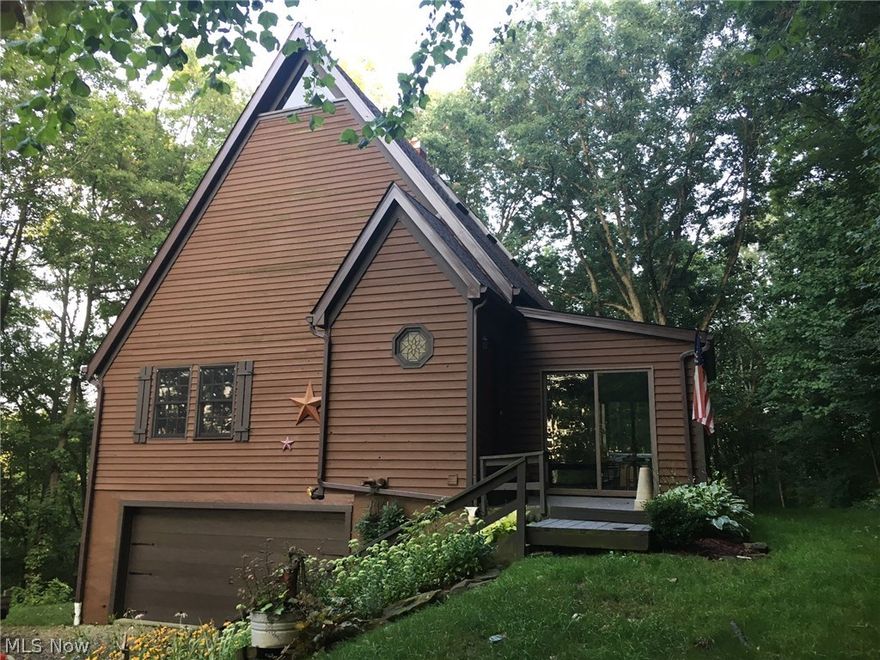 Seclusion surrounds this 2.75 acre wooded property.  This post and beam home boasts quality throughout with numerous windows to the amazing views.  Large farmer's kitchen with breakfast bar and eating area is open with light galore.  Hardwood floors and vaulted ceilings sprawl through the great room and kitchen areas. Fireplace is nestled between the great room and kitchen for that perfect feel.   The master is complete with attached bath and hardwood floors. Loft area above the second floor is beautiful for displaying your favorite things.  The 4 season sunroom will take you to the outdoor hot tub area and surrounding decks.  The lower level has an additional bedroom or family room and full bath.  Storage throughout this one of a kind quality home.  Recent updates include: Roof 2014, water heater 2016, furnace 2002, central air 2013, generator, and recently filled propane tank. Fully applianced.  The driveway is deeded.  Perfect for your weekend getaways or day to day living.  Close t