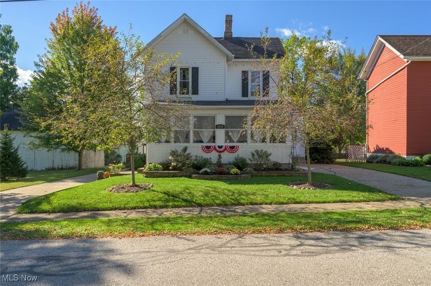 Welcome home to 4708 Woodford St. in the heart the charming Village of Mantua!  This century home has been meticulously cared for and is full of warmth and character.  Take in the morning sun enjoying your coffee in the large enclosed front porch.  Upon entering you will be greeted by an inviting living, or dining, room with exposed brick, built in shelves and new LVP flooring.  Enjoy the extra large eat in kitchen featuring an adorable breakfast nook.  Stay warm in the large family room featuring a newer wood burning stove, large picture window and Dutch door that opens to the side porch.   Through the barn door you will find the first floor primary with a walk in closet and hidden door to the bathroom!  Upstairs you will find 3 large bedrooms, 2 with walk in closets, and a second large full bathroom.  Outside you will find an oversized 2 car garage with a sliding barn door, loft and 220V dedicated electric panel perfect for your workshop!  Some of the many updates include the Furnace 2025, LVP 2023, H20 tank 2020, Vermont Castings wood stove 2020.  Home Warranty included for your peace of mind!  Don't miss your opportunity to be close to the shops, restaurants, festivals and all that Mantua has to offer!