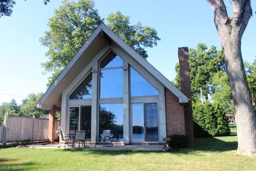 Phenomenal views of Turkeyfoot lake with 80' of waterfront (2 lots) plus an additional 2 lots on corner of Barrymore & Hyman* Wonderful brick & cedar contemporary A-Frame rebuilt 1995 with 2-3 bedrooms, 2 bath, 2078SF & all oak floors on main level* Vaulted great room with gas fireplace & full window wall* Living room or office* Eat in kitchen with refrig, range , dishwasher, fireplace & disposal* 2nd bedroom & guest bath on main level* 1st floor laundry including washer & dryer* 2nd level with loft, master bedroom & master bath with sky light, separate shower & corner jetted tub* One car attached garage* Storage shed* Septic system approx. 2008* Concrete sea wall with 2 docks* Total of 4 parcels* Home warranty provided* Immediate possession*