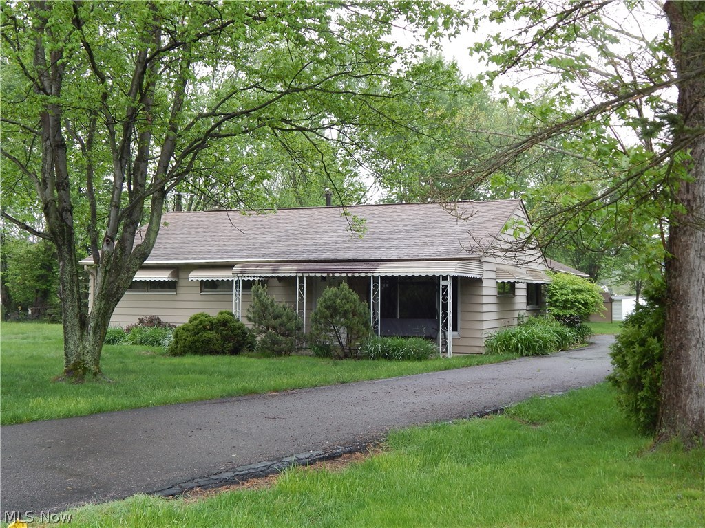 Great ranch on large wooded lot offers spacious oak kitchen, large utility area with 3 closets for extra storage, neutral decor, central air, large 2 car attached garage with opener. Enjoy summer days and nights on the covered front porch...lots of privacy...close to schools, parks, shopping, restaurants, and freeway access. A great place to call home!!