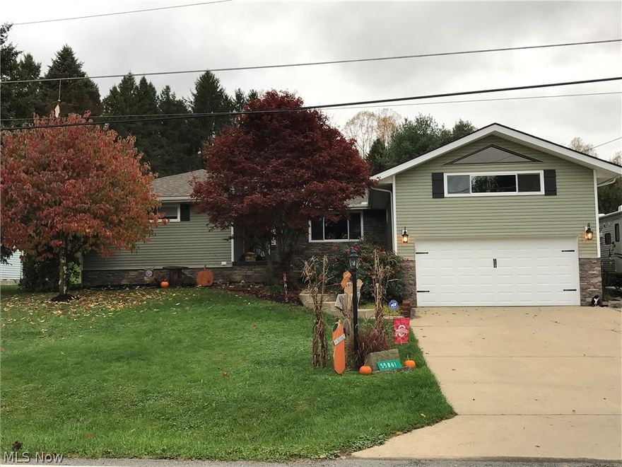 Sprawling ranch home in desirable Bel Haven with many updates! This three bedroom, two bath home boasts a first-floor master suite, two separate living room areas, a spacious and modern kitchen, and first floor laundry, plus new siding and stone on the exterior of home. Enormous deck off back just stained this year and new roof over part of deck to provide shade and comfort. Third bedroom in lower level of home. There is an attached two car garage and a separate 12' X 16' storage building. Must see this home!