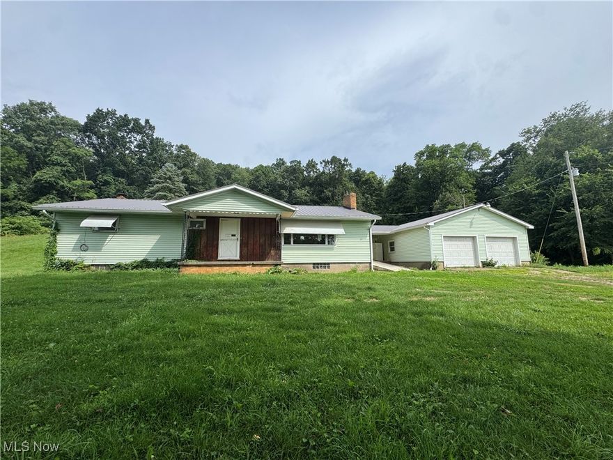 Great opportunity for a fix and flip!  This ranch home has tons of potential.   3 beds/2 full baths sitting on approximately 3.2 acres in a nice rural location, yet close to town.  Full basement.  The home is solid but needs work.  Vinyl siding.  Metal roof was recently installed. 2-car detached garage.  Fix it up as your own or use it as an investment opportunity!