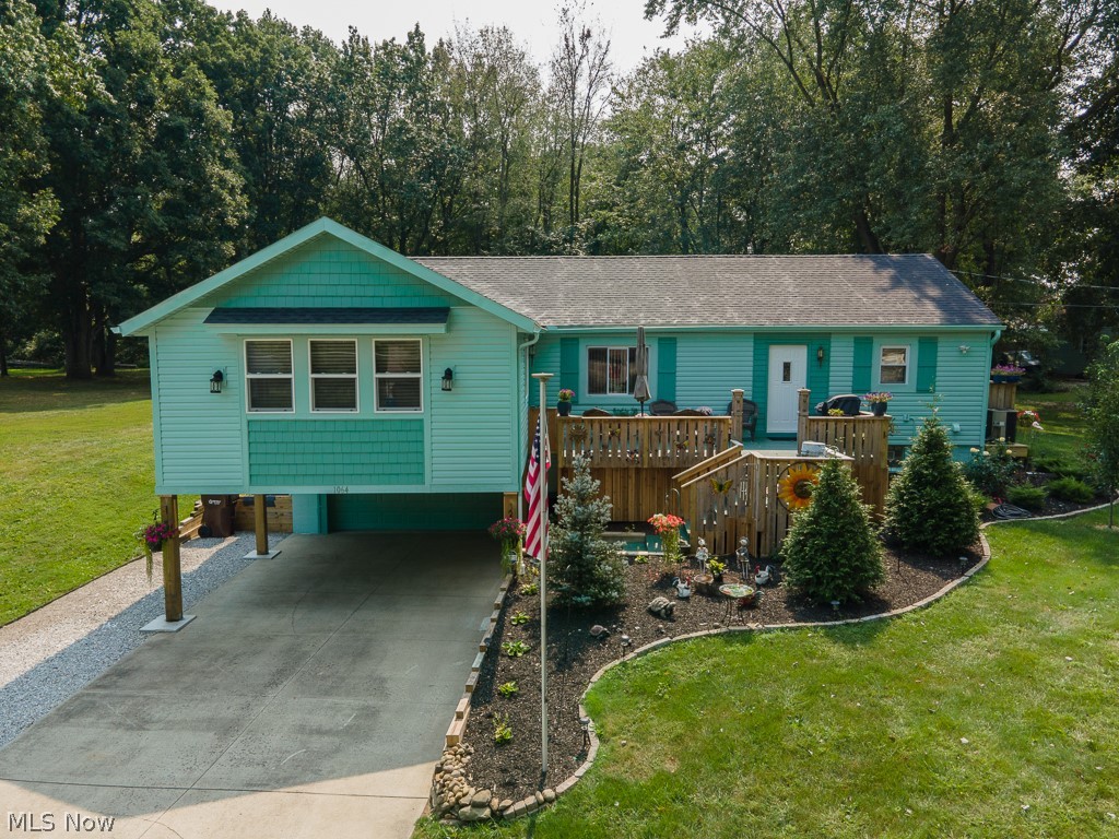 Lovely, updated 4 BR, 2-1/2 BA Ranch on .6615 acre. Huge addition of 19x19 living room w/built-in electric fireplace, opens to dining room & then totally remodeled, fully applianced eat-in kitchen w/island & breakfast bar overlooking the huge front porch. 1st floor master bedroom w/walk-in closet & master bath w/walk-in shower & soaker tub. Other end of the house has 2 more bedrooms w/double closets, main bathroom, & 1st fl laundry/utility room. Finished, walk-out lower level includes 4th bedroom, rec room w/gas fireplace, & half bath w/toilet, urinal, vanity/sink & utility tub combined w/utility/furnace room. Attached garage is heated w/30,000 BTU gas heater, has 220 electric, water, opener & keypad, & there is a 2-car carport in front of garage, along w/a 60-foot extra lane along the driveway for your boat/RV. All kitchen appliances stay along w/washer, dryer, 2nd fridge, dehumidifier, 65" & 75" Samsung Q-series TV's, & Craftsman 42" cut riding mower w/dump/yard trailer, 2 sheds. Al