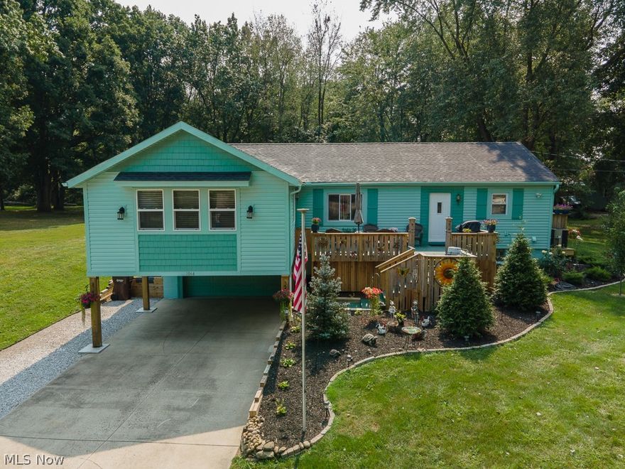 Lovely, updated 4 BR, 2-1/2 BA Ranch on .6615 acre. Huge addition of 19x19 living room w/built-in electric fireplace, opens to dining room & then totally remodeled, fully applianced eat-in kitchen w/island & breakfast bar overlooking the huge front porch. 1st floor master bedroom w/walk-in closet & master bath w/walk-in shower & soaker tub. Other end of the house has 2 more bedrooms w/double closets, main bathroom, & 1st fl laundry/utility room.  Finished, walk-out lower level includes 4th bedroom, rec room w/gas fireplace, & half bath w/toilet, urinal, vanity/sink & utility tub combined w/utility/furnace room. Attached garage is heated w/30,000 BTU gas heater, has 220 electric, water, opener & keypad, & there is a 2-car carport in front of garage, along w/a 60-foot extra lane along the driveway for your boat/RV. All kitchen appliances stay along w/washer, dryer, 2nd fridge, dehumidifier, 65" & 75" Samsung Q-series TV's, & Craftsman 42" cut riding mower w/dump/yard trailer, 2 sheds. Al