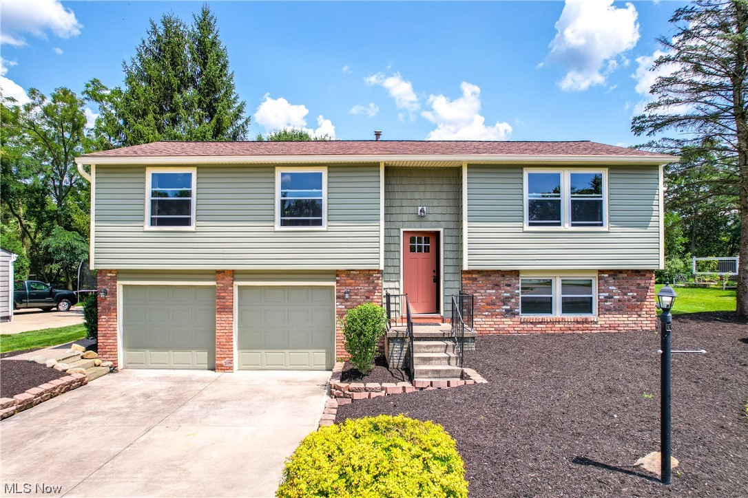 Welcome home to this beautiful 3 bedroom split level home with 2 full baths, a lower level rec room and an all seasons room that leads to your spacious back yard!! Live like you're on vacation in the private lake community of Aurora Shores! 305 acre lake for swimming, fishing, boating, water skiing, tubing, paddle boarding, kayaking, etc. 2 soft sand beaches, 2 in ground heated swimming pools, 2 playground facilities, 4 tennis/pickleball courts, basketball courts, sand volleyball court, baseball diamond, swim team, party center, marina, & tons of planned parties/events for residents. Recent updates completed in the last 2-3 years include new siding, new roof, new gutters, new doors, new A/C, new garage door openers and both bathrooms remodeled!! All kitchen appliances stay so all you have to do is move in!!