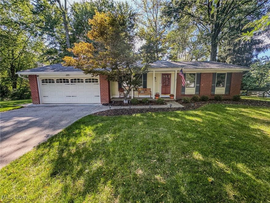This charming updated ranch offers a perfect blend of comfort and style. The home features a two-car attached garage for convenience. Inside, you’ll find a welcoming family room complete with a cozy fireplace, built-in shelving, and sliding doors that open up to a serene screened-in porch. This outdoor space is perfect for enjoying the lush, wooded backyard. The spacious eat-in kitchen is a highlight, featuring an island, double oven, and sleek stainless steel appliances, making it ideal for both cooking and casual dining. The home includes three well-appointed bedrooms and two full bathrooms, ensuring ample space for family and guests. Enjoy peace of mind knowing this home is equipped with a backup power generator. Overall, this ranch is a delightful retreat that seamlessly connects indoor and outdoor living.