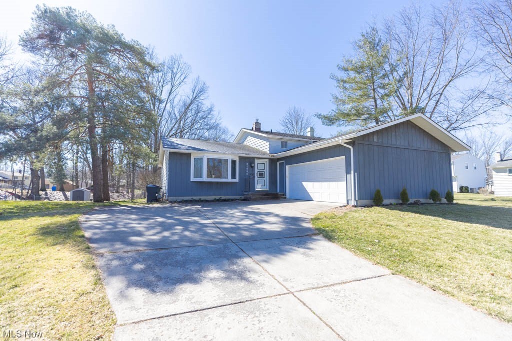 Great opportunity to make this spacious split-level home your own! Located on a quiet street this home offers 4 large bedrooms, 2 full baths, large living room and family room with a wood burning fireplace.The unfinished basement and large 2 car garage are more than spacious enough for storage! Updates to this home were in progress but due to outside circumstances had to be put on hold, making this the perfect home to be uniquely yours. A true diamond in the rough with great equity potential.