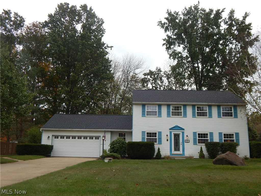 Wonderful Hudson Location. Own with pride and enjoy the private wooded rear yard. Comfortable stylish 4 bedroom Colonial featuring chef's delight kitchen with granite counter tops, under cabinet lighting and fully appliance. Enjoy the family gatherings in the expanded Vaulted gathering room with gas fireplace, build in book shelves and wine racks. Large Wall TV remains with home. Original owners have taken great pride and maintained this home to the fullest. First floor laundry, office area, and full size three season sun room. Many possibilities in the finished lower level featuring entertainment area, game area and plenty of storage. Owners suite features walk in closet, full bath and newer carpet throughout. Addition nice size bedrooms have been freshly painted and carpeted and await your quick move in. Call to see today!!! Move in ready.