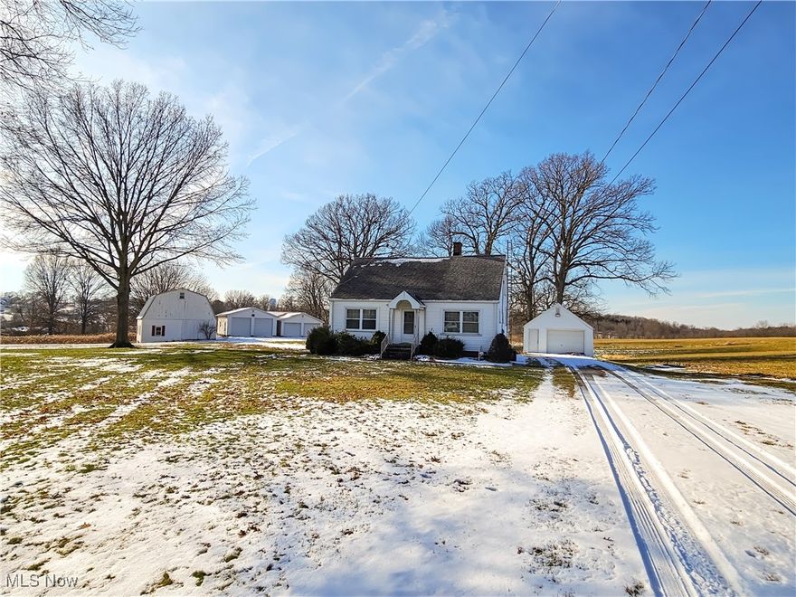 Arriving at just the right moment... Here is your chance to own 15 beautiful acres set back in Perry Township, this property offers the kind of space and flexibility that’s getting harder and harder to find. The land is a true highlight—open, usable, and ideal for hobby farming, recreation, equipment storage, or simply enjoying privacy and wide-open views.

The well-maintained Cape Cod–style home features 4 bedrooms with 2 on the main level and 2 upstairs, along with 2 full baths— Updated vinyl replacement windows throughout. A covered back porch provides a quiet spot to relax and take in the surrounding acreage.

What truly sets this property apart, in addition to the land, is the exceptional amount of garage, barn, and outbuilding space. Multiple accessory buildings offer over 3,700 of square feet of covered storage (not even including the barn, cellar and multiple run-ins) making it perfect for contractors, car or equipment enthusiasts, small-scale agricultural use, workshops, or a home-based operation.

Located in Perry Township within Perry LSD, with convenient access to Massillon and surrounding areas, this is a rare opportunity to own a substantial acreage property with public utilities and a solid infrastructure already in place—practical, private, close to modern conveniences and full of potential. Hurry to schedule your showing now before it's gone!