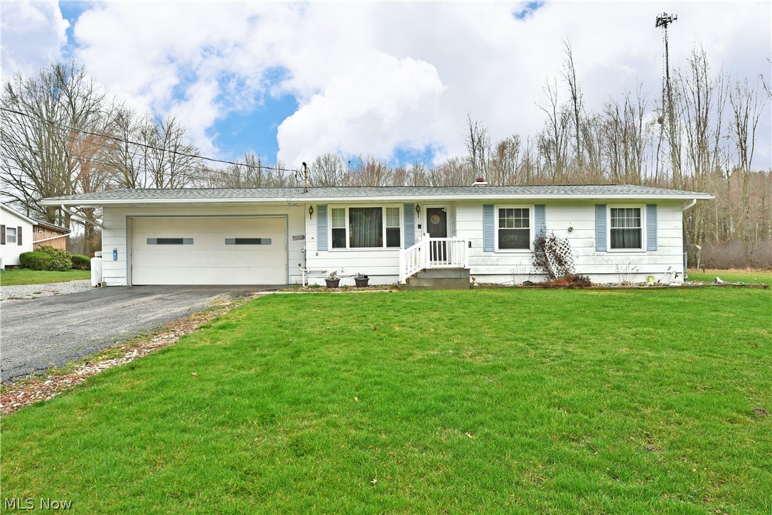 Take a closer look at this fresh on the market Bristolville ranch; with its desirable three-bedroom layout, fenced-in backyard with storage shed and finished basement this potential packed home has all the right moves in all the right places. Tidy, stone landscaping wraps the front of the home as the bright blue shutters add a splash of color. The two-car garage runs extra deep, showcasing a fantastic rear workshop space or easy equipment storage. Inside, a carpeted great room opens beneath the tall ceilings with its exposed wooden truss. Casual dining enjoys backyard views as natural light cascades through the oversized picture window near the foyer. A galley layout kitchen provides an array of cabinetry as it runs alongside the main hallway. A trio of inviting first floor bedrooms branch away with impressive dimensions and ample closet space. They join a handsome full bath at mid hall along with basement access. Downstairs, an engaging family room reveals an additional bonus room while opposite, storage, laundry and extra shop provisions complete the floor. Home has a new roof (2019), windows (2011) a fully fenced in back yard. Home being sold As-Is.
