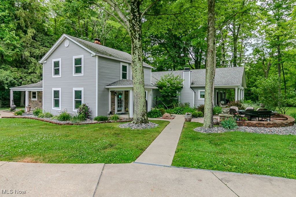 Spectacular 3 acre property boasting firepit area, putting green and even a checkboard lawn game. Perfect for outdoor entertaining. 1500 sf primary suite addition added in 2018 with glamour bath, custom closet, private office space, sitting area with fireplace and room for your exercise equipment. New windows and stone/wood siding in 2018. All kitchen appliances new in 2024. Oversized four car heated garage.