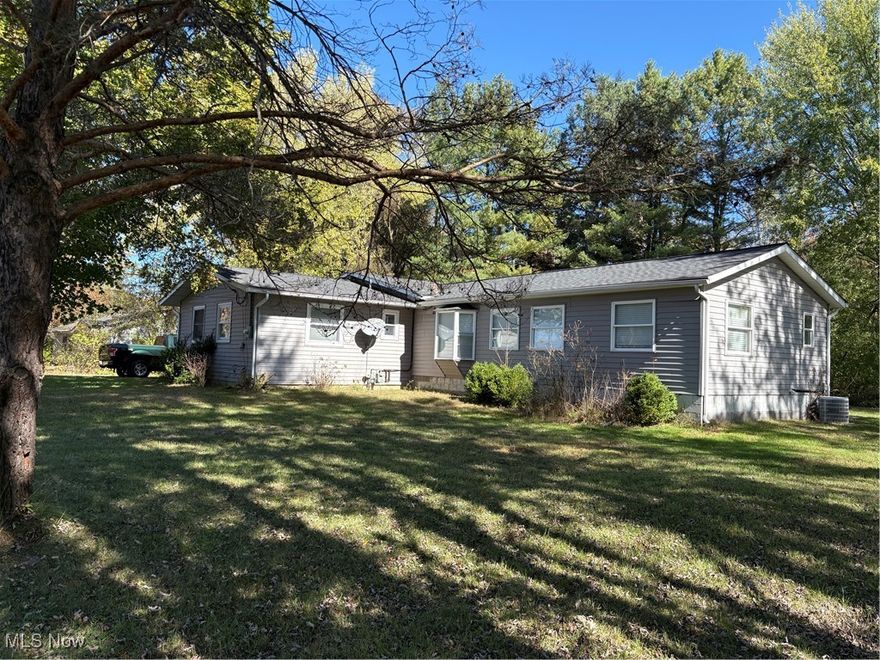 Cute ranch style home tucked away off the main road. Double lot contiguous with community park allowing access to Lake Roaming Rock for swimming, fishing, and boating. Nice back yard with a covered deck off the kitchen as well as an adorable covered porch on the garage, both overlooking the family fire circle. Woods all around provide excellent privacy. Wonderfull large open kitchen with wood vaulted ceilings, a beautiful large island for all to enjoy, and a good sized eat-in kitchen area with room enough for all! Nice cozy living room with a bay window at one end and a 2 sided gas fireplace on the other. The fireplace looks through to the back yard. The living room also has a double french door leading to back yard. Good sized bedrooms and 2 nice baths. With just a few small finishing touches, this home could be your perfect family home!