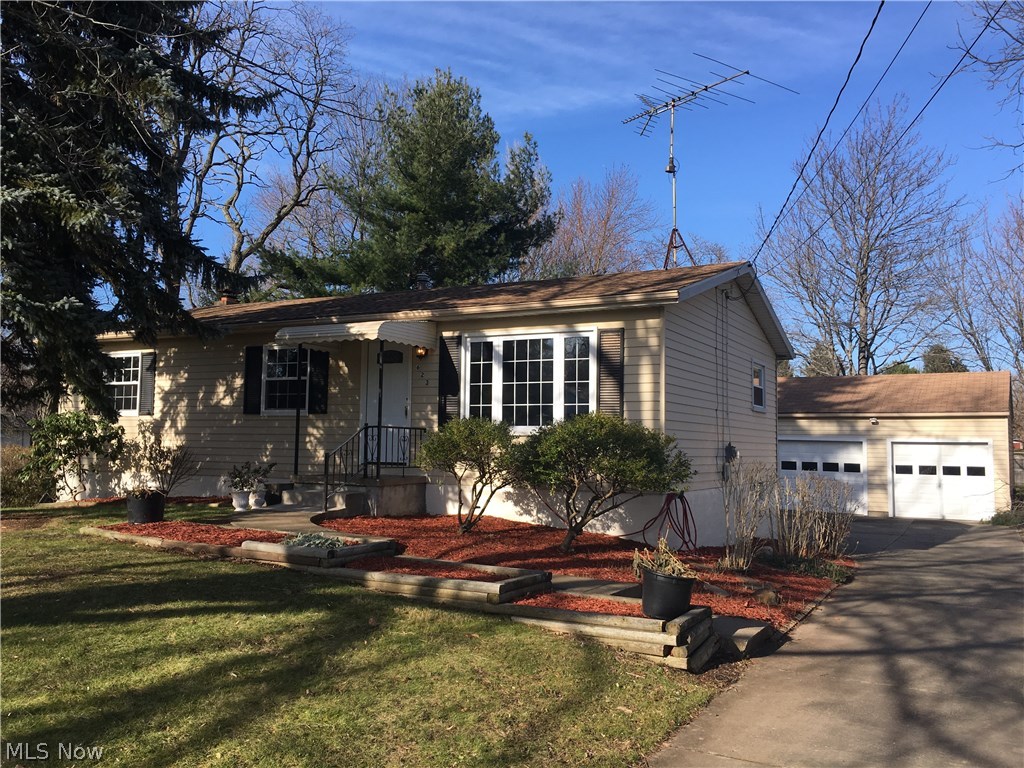 This is a must see ranch located in the Eastern section of Tallmadge south of the Circle. Built in1974, this home has been well cared for and sits on a gorgeous private lot. Inside, it is almost like a new home with partially remodeled kitchen & updated baths, All floor coverings have been replaced. The kitchen, dining and living room have beautiful laminate wood textured floors in high fashion dark wood finish. The kitchen is open to the living area with a breakfast bar. There are loads of cabinets and countertops are the latest laminate. All bedrooms have brand new carpeting and virtually every inch of the interior was just repainted in beautiful fashion colors. All work was done professionally. There is an abundance of natural light streaming thru the living areas and the walkout basement is ready to finish and has fireplace wall feature and a full bath! Exterior landscaping has just been professionally manicured. The apron of the house was just repainted too. The upper portions of