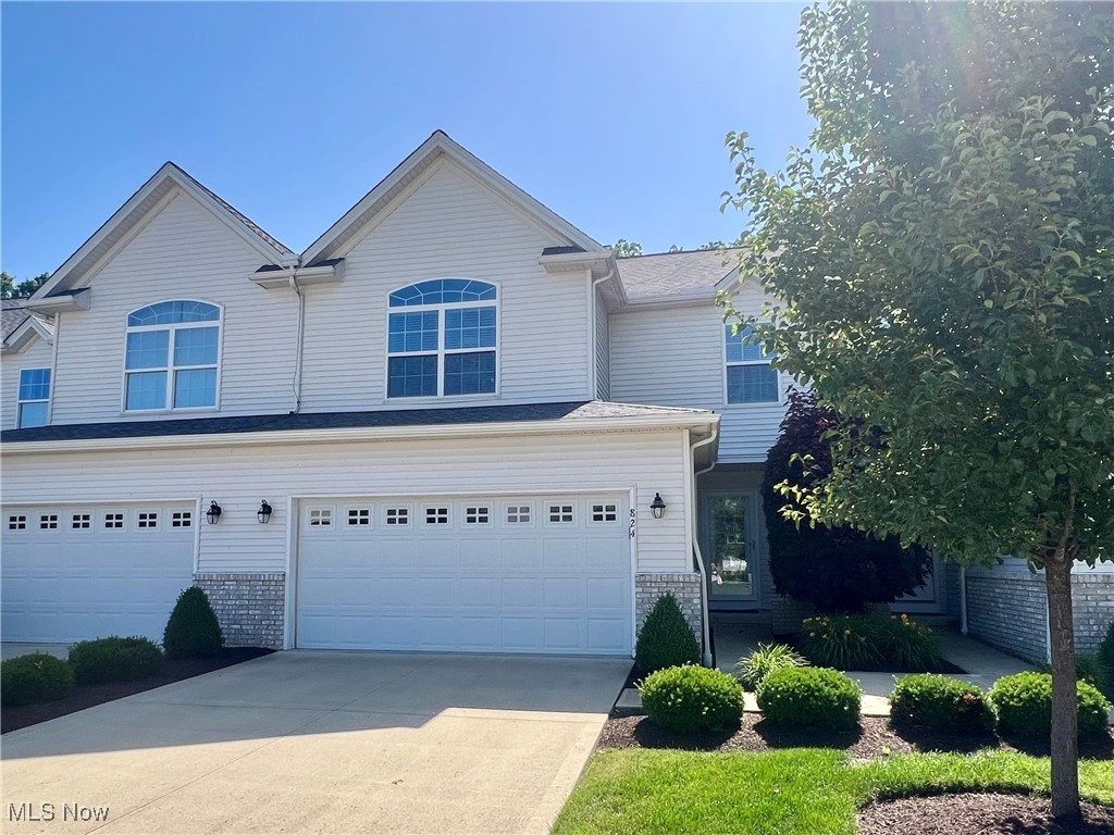Welcome to 824 Wildberry Circle in Avon Lake - a beautifully maintained 3-bedroom, 2.5-bath townhouse offering more than 2,000 sqft of comfortable living space! Backing to peaceful woods for added privacy and views, this home features a light-filled four seasons room perfect for relaxing year-round. Enjoy an open-concept layout and generously sized bedrooms, including a primary suite with en-suite bath and a walk-in-closet. The main level includes high ceilings, a gas fireplace, and a large eat-in kitchen complete with stainless steel appliances and a mini coffee bar. The first floor laundry and attached two-car garage add everyday convenience. The spacious finished basement provides extra room for entertaining, a home office, or fitness area, with additional storage as well. The options are endless! Residents also have access to the community pool - just in time for summer! Here you will find the low-maintenance living with the amenities and location you've been looking for. Schedule your showing today!