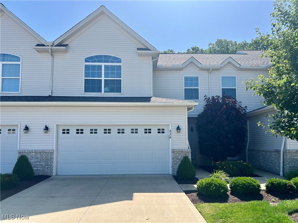 Welcome to 824 Wildberry Circle in Avon Lake - a beautifully maintained 3-bedroom, 2.5-bath townhouse offering more than 2,500 sqft of comfortable living space! Backing to peaceful woods for added privacy and views, this home features a light-filled four seasons room perfect for relaxing year-round. Enjoy an open-concept layout and generously sized bedrooms, including a primary suite with en-suite bath and a walk-in-closet. The main level includes high ceilings, a gas fireplace, and a large eat-in kitchen complete with stainless steel appliances and a mini coffee bar. The first floor laundry and attached two-car garage add everyday convenience. The spacious finished basement provides extra room for entertaining, a home office, or fitness area, with additional storage as well. The options are endless! Residents also have access to the community pool - just in time for summer! Here you will find the low-maintenance living with the amenities and location you've been looking for. Schedule your showing today!
