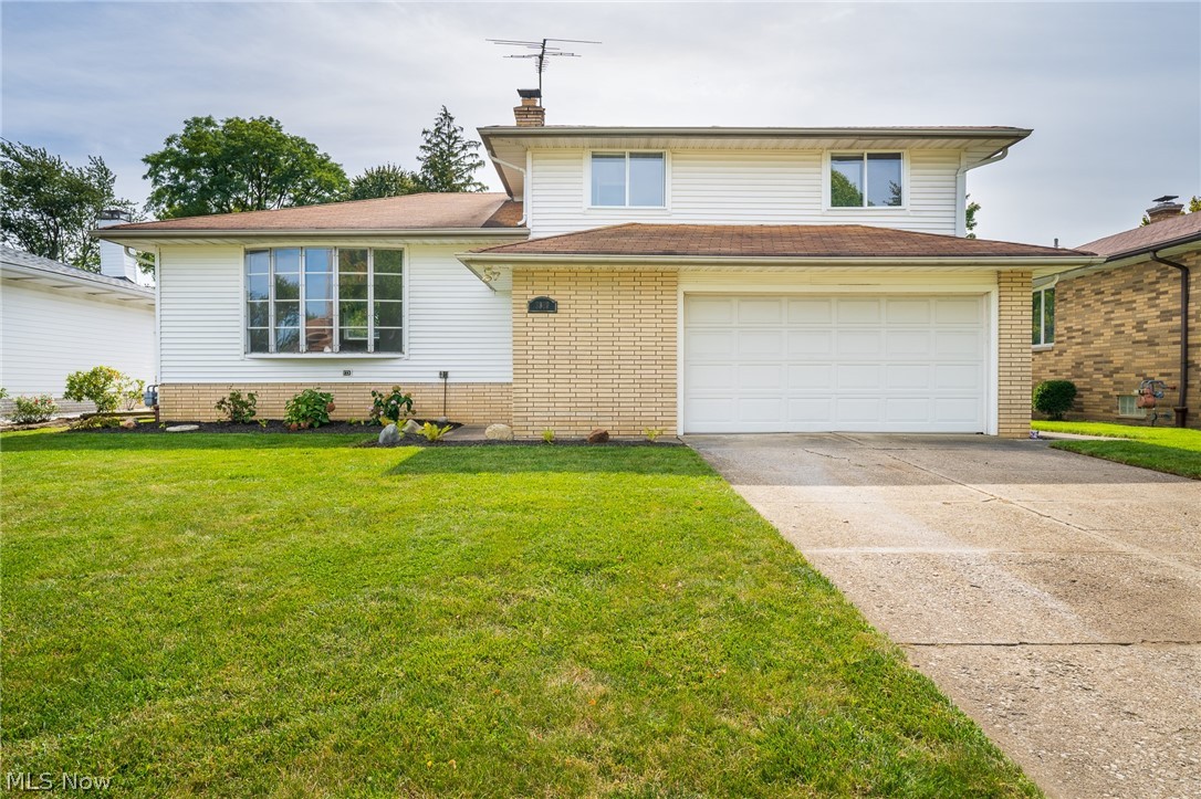 Welcome to this beautiful split level in the heart of Parma. You enter into a bright foyer with an attractive slate floor. Then, step up to the spacious living room with a large bay window. The living room opens up to the dining room and the fully renovated kitchen with lots of cabinet space and brand new appliances. Spacious family room for entertainment that leads to the enclosed sunroom with sliding doors for easy access to the backyard. Upstairs you will find three spacious bedrooms with a newly renovated full bathroom. Lots of storage, new vinyl flooring throughout and partially finished basement. Attached is a two car garage and much more...  Close to shopping, dining and parma area schools. Schedule your private tour today, it will not last.