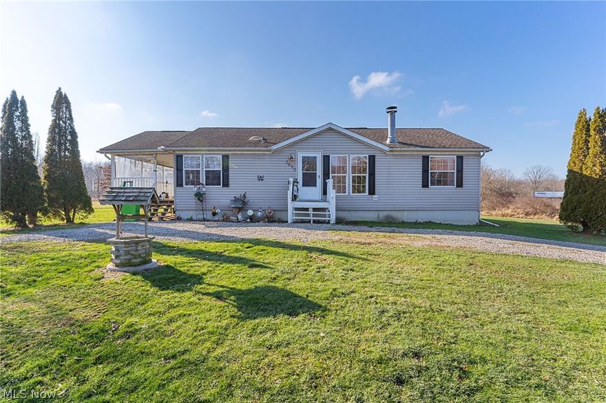 Beautifully Updated Ranch on 12 Plus Acres! Tastefully decorated 3 beds 2 full baths all on one level.  Kitchen has an abundance of cabinets and counter space, a skylight, and vaulted ceilings. Kitchen appliances are included. Laundry room also doubles as a mudroom off the wonderful and large covered porch. The living room has vaulted ceilings and a majestic wood burning fireplace. The master bedroom is spacious and has a large walk-in closet. The huge master bath has a skylight, a sunken tub, and a walk-in shower. The two other bedrooms have good-sized closets also. The main bath is updated and has a skylight and vaulted ceiling. Newer laminate flooring in the living room and bedrooms. There is a full basement that has the wall studs in place ready for finishing to double your living space.  There is rough-sawn wood in the basement to finish the walls. A barn has awnings on both sides and a loft for storage.  The multi-acre lot is flat and partially treed. This property has a lot to o