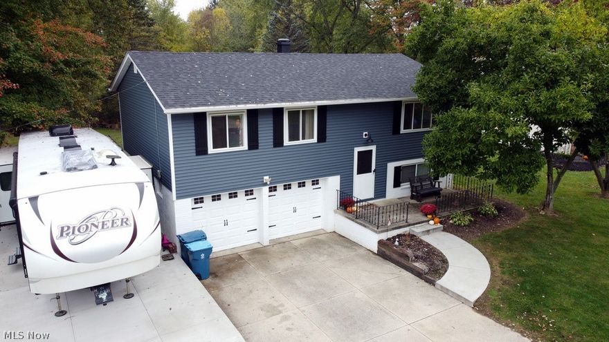 Move right in to this charming 3 bedroom, 1-1/2 bath home in Manchester. Camping/boating enthusiasts will love the attached two car garage with a new concrete side parking pad for your RV/camper, boat or 3rd vehicle. The new sliding glass door from the dining area adjacent to the eat-in kitchen provides access to a new wood deck and fully fenced back yard. Owners added vinyl siding and don't worry about the roof; it was recently replaced too! There are hardwood floors on the main level under carpet and in the bedrooms.  All appliances will stay with the home. 2019-2020 new roof, gutters and siding. Move in before the snow -- schedule your showing today!