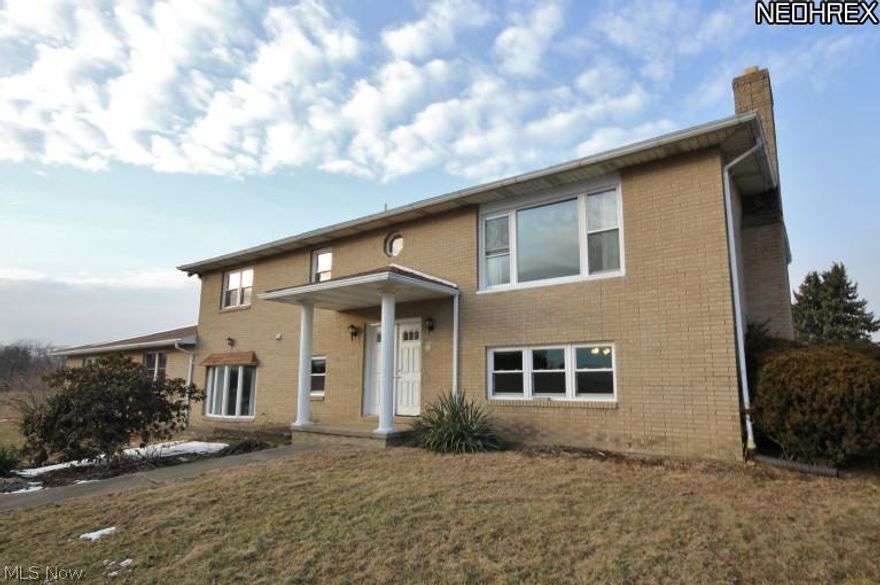 Large brick home, over 3000 square ft. of living space, newer kitchen, beautiful hardwood floors, pull down stairs to insulated attic that runs across entire home, 4 bedrooms 3 full baths, large family room