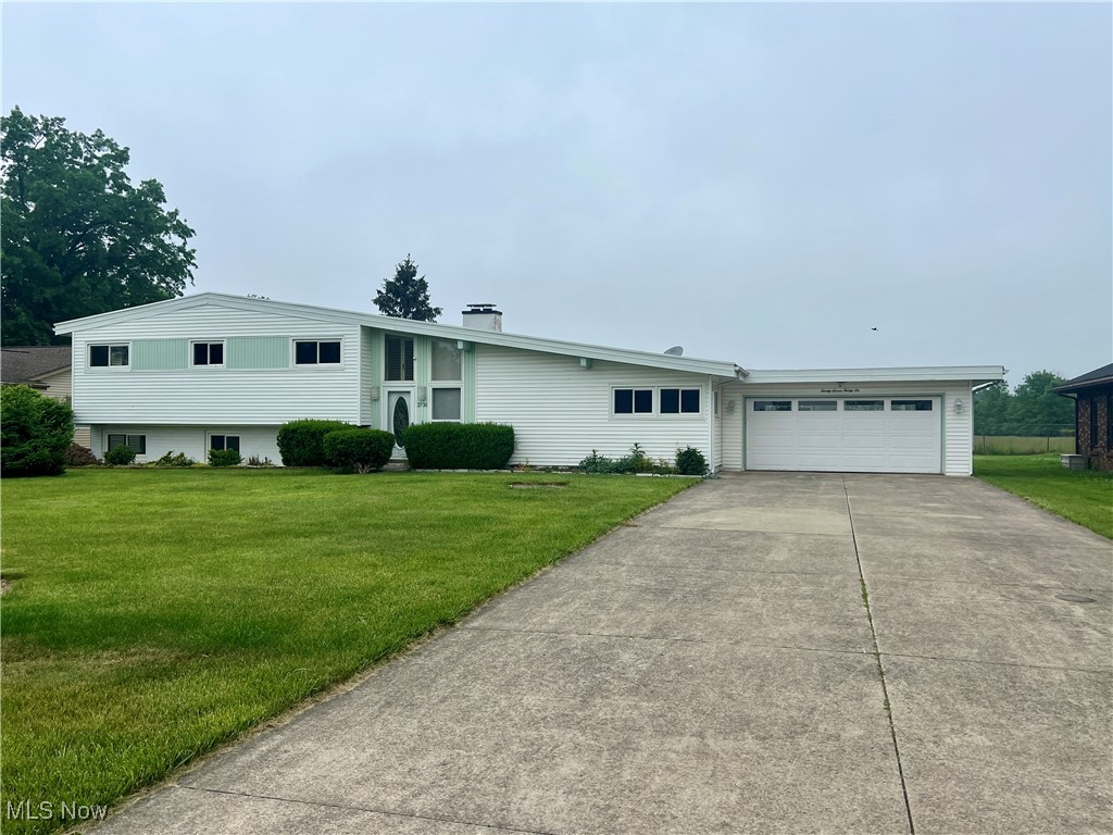 This home truly has it all! Welcome to 2736 W. Skyline Dr. - a spacious and well-maintained 4 bedroom, 3.5 bathroom, split level home offering over 3000 sqft of living space, ideally located just off Leavitt Rd. Inside, you'll find generously sized rooms and plenty of storage throughout. The main level features high ceilings, and a dining area large enough to comfortably seat eight. Just off the dining room, step into the expansive sunroom - the perfect place to relax, entertain, or utilize the large built-in cabinets for storage! Outside, enjoy cookouts on the covered patio barbecue and take advantage of the two backyard storage sheds for all your extra belongings. The lower level is ideal for entertaining, featuring a large bar with seating for seven, a pool table, cozy fireplace, and direct access to the backyard. The garage features two electric garage doors. All appliances remain including the extra fridge and upright freezer in the laundry room. Additional highlights include windows (2017), new shed roof (2023), main roof inspection and repairs (2025), lift master for rear garage door (2023), and hot water tank (2023).
