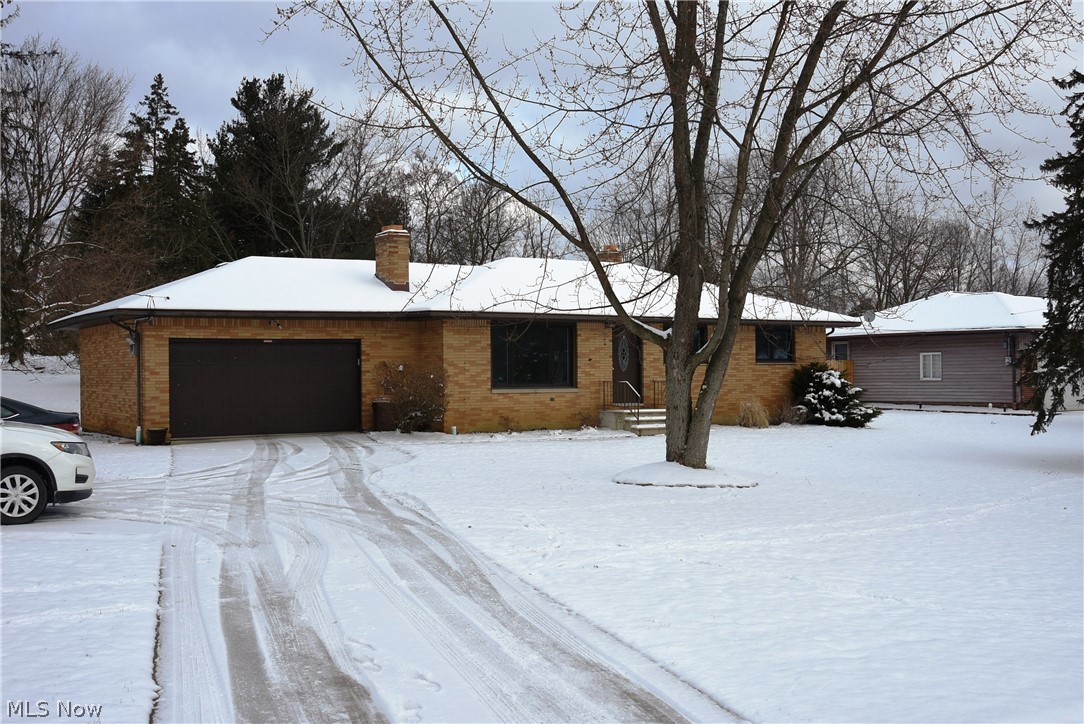 Nice 3 bedroom Brick Ranch. Large deep lot (approx. 1/2 acre) located in Broadview Hts. You will enjoy the hardwood floors in the living, dining, and all 3 bedrooms. Finished basement with Fireplace makes a great place to entertain. Plus, there is a built-in bar and lots of room for pool table, ping-pong table, and a Full Bath, Recently Renovated. The lot is very large (85' x 235') with a huge private backyard which can easily be fenced for pets or children. Upgrades have been started and include newer windows, Attic Insulation, Electrical Panel, central air, and a newer garage door. This house is an excellent investment.