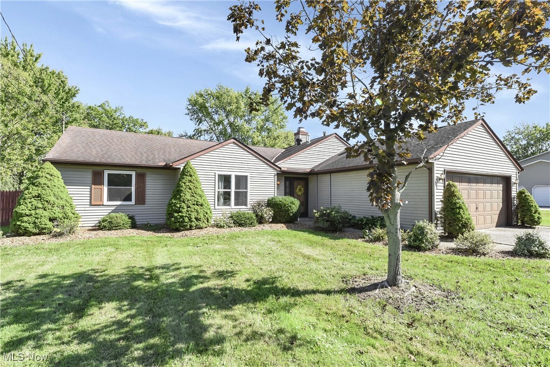 Prepare to be Moved… into luxury single floor living with this wonderfully updated ranch in North Ridgeville! Boasting 4 bedrooms and 2 full bathrooms, this spacious home is the perfect place to raise a family, entertain guests, and all of your other growing needs. Step in from the oversized 2-car garage into the huge eat-in kitchen filled with natural light. The attached living room has tall, vaulted ceilings and a brick, wood-burning fireplace, fit for cozy gatherings with all of your friends and family. All 4 bedrooms are large and offer plush carpeting and overhead lighting — not that you need it with all the natural sunlight streaming through the updated windows! The luxurious master bedroom is a serene oasis, fit with its own ensuite bathroom, walk-in closet, and gorgeous views of the private backyard. The HUGE fully fenced-in backyard backs up to wooded views, offering the perfect place for family memories, outdoor hobbies, and never-ending fun for kids and furry friends. Entertain guests on the large patio and have nights of relaxation next to the fire pit as you look up at a clear sky of stars. Raised flowerbeds create a gardening delight while the shed has ample storage for all of your essentials. Updates over the last couple of months by the current owners include carpet and updated flooring, professional landscaping in both the front and back yards, fresh paint, and a beautifully remodeled bathroom! Home also has all updated windows throughout and a large attic space for additional storage. Amazing North Ridgeville location close to the center of town for shopping, schools, and restaurants. Conveniently situated between I-90 and I-480 for an easy commute. With its perfect blend of modern comfort and outdoor living, all this beautiful home is missing is you!