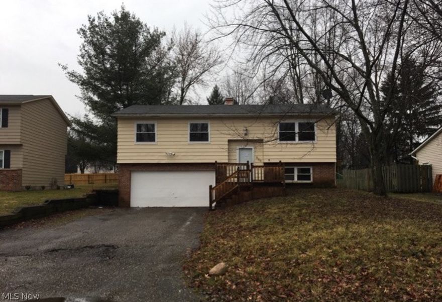 This is a FANTASTIC OPPORTUNITY to purchase a home within Manchester school district!!! Very nice front porch/walkway; some T.L.C outside would give this home great curb appeal!!! The living room, kitchen & dining area offer an open concept layout with sliders out to a MASSIVE deck overlooking the back yard which would be AWESOME for entertaining!!! Three bedrooms and a full bathroom round out the main level. Downstairs find a partially finished lower level with a room ideal for a fourth bedroom or office, as well as a half bath off of the utility room!!! The large, 2 car attached garage has a newer sump pump and offers walk-out access to the back yard!!! LOADS OF POTENTIAL FOR SWEAT EQUITY!!! Realize the value offered and make this your next dream home before it's GONE!!! This property is eligible for the Freddie Mac FIRST LOOK Initiative through 4.30.2018!!!