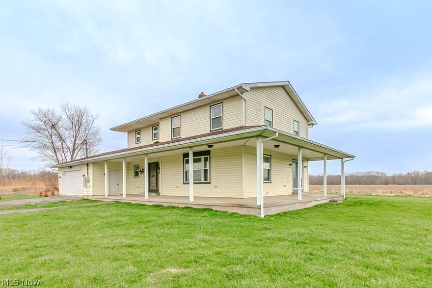 Gorgeous colonial with an inviting wraparound porch, perfectly situated on over an acre, offering exceptional privacy and a peaceful setting. This fully remodeled home showcases a thoughtfully designed open-concept layout, where the kitchen and living areas seamlessly blend to create an ideal space for everyday living and entertaining. The stunning kitchen features marble quartz countertops, a center island, updated cabinetry, and modern finishes, all complemented by newer flooring that flows throughout the main living areas. A beautiful custom fireplace anchors the living space, while all newer lighting, fixtures, and ceiling fans enhance the home’s appeal. The interior has been refreshed with newer laminate flooring and plush carpet in the bedrooms, along with three fully renovated bathrooms offering stylish finishes and functionality. Significant improvements include newer windows, newer sliding glass doors, and an impressive front entry door, along with updated electrical panels, a whole-home surge protector, and extensive electrical upgrades. The home also features a high-efficiency propane furnace, central air conditioning, and a 50-gallon hot water tank, plus a water softener and advanced filtration system with UV sterilization. The full basement offers poured concrete walls and oversized concrete stair access through the attached heated two-car garage. Additional highlights include attic storage above the home, garage, and porch, a low-maintenance concrete wraparound porch, and a recently installed drainage system. Mechanical updates include newer sump pump configurations, updated propane lines, and a 22kW whole-home generator with upgraded 200-amp service. Exterior improvements feature newer concrete pads, a privately owned 500-gallon propane tank, and landscaping enhancements. With a roof replaced in 2016 and a complete remodel in 2021, this home offers comfort, efficiency, and peace of mind.