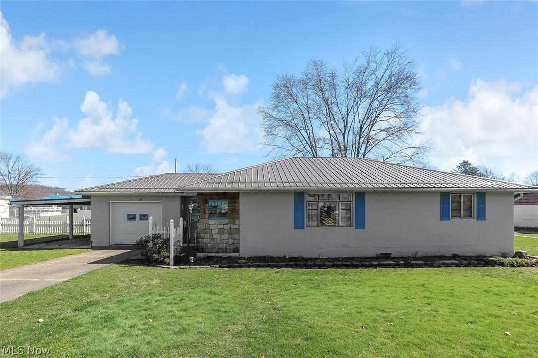 Situated on a spacious fenced in lot in the Mizer Addition this two bedroom, one bath home features nice landscaping, newer roof, newer boiler, and a workshop with second story storage.