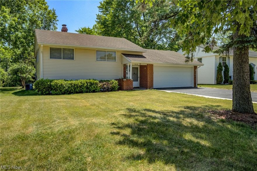 Beautifully renovated bi-level in the great city of Bedford Hts.  This home offers newly remodeled kitchen which includes new cabinets, refrigerator and stove and is open to a spacious family room that can also be used for entertaining.  The main bathroom has been tastefully updated along with additions to the lower bathroom.  Brand new flooring through out including a mixture of carpet and vinyl combined with fresh paint gives the home crisp and warm feel.  Electrical updates include a new panel, new plugs and recessed lights in addition to motion lights in the living room.  A brand new driveway installed that leads into the two-car attached garage with an epoxy coating giving a polished finish. The exterior boasts a huge backyard that would be great for your kids and/or pets to run and play.  This won't last long so call today to schedule your showing