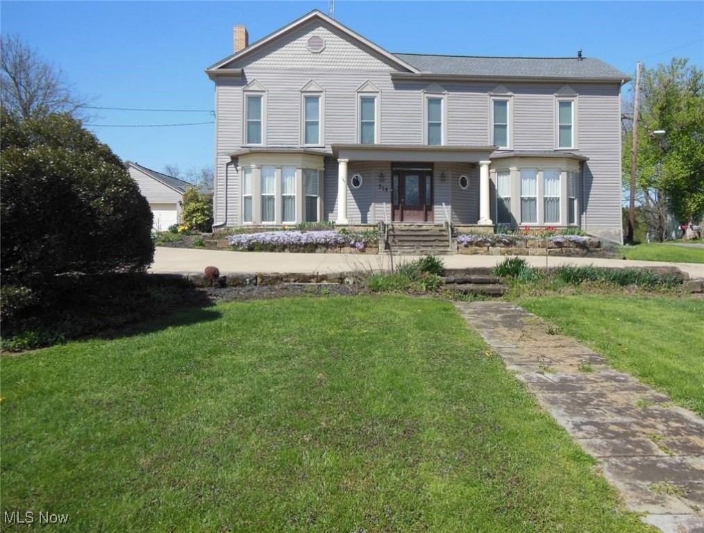 This Greek Revival home built in 1841 by Arnold Medbery who was a major entrepreneur during the foundation of Roscoe Village sets on 7/8 of acre +- of well-maintained grounds and boasts a private back yard with a water garden. Located 1 block from Roscoe Village, it has 4200 square feet of living space with a workshop added to the full 2 car detached garage. This home has been operating as the Medbery Manor Bed & Breakfast for 23 years, but owners are retiring and moving away. This fine home offers 5 BR 4 ½ Bath with a mother-in-law suite that has its own private entrance, full kitchen, living room, private bath, bonus room, and office space. The main house has a formal dining room, updated kitchen with island and quartz counters. The 3rd floor attic could be finished for additional living space. All windows have been replaced. There are 2 furnaces and 2 air conditioners. One furnace was installed in May of 2025. There is a 200-amp service in the main house and a 100-amp sub panel in the garage. The walkout basement is unfinished. Roofing and siding approx. 10 years old.
Taxes to be prorated to date of closing. Property sales as-is