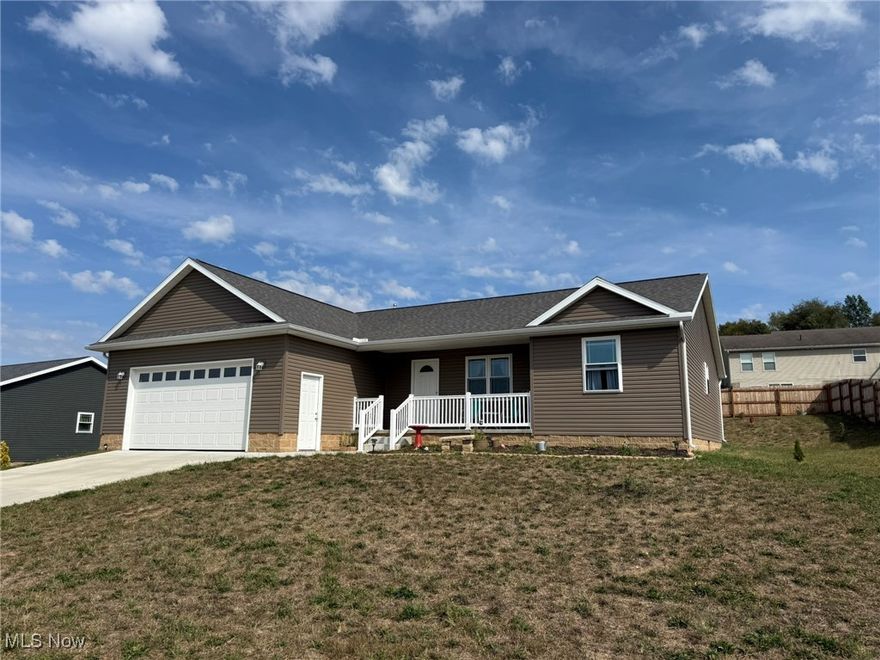 Like new 3 bedroom, 2 bath vinyl sided ranch home.  Open floor plan with quality wood laminate flooring.  Dark oak kitchen with island breakfast bar.  Walk in closet in the master suite with full bath featuring a walk in shower.  First floor laundry.  Full basement.  2 car attached garage.  Private, cedar fence enclosed backyard.  Quality Amish built by Maple Valley Construction.  Conveniently located in Holly Heights, just minutes to I-77.  A must see.  Exclude hand towel holders in the master bath, solar lights, bird baths, cement bench, statuaries and flower buckets.  Taxes reflect the seller receiving a homestead credit of $469.10 annually.  Subject to seller finding suitable housing.