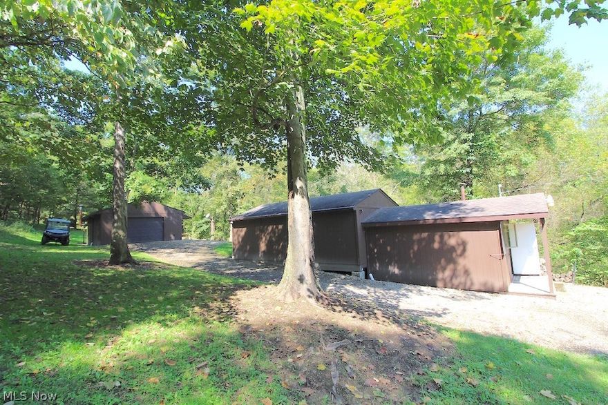 42.02 wooded acres. Very nice year around spring fed creek through property. Well maintained trail system with bridges. 3 raised box blinds to stay. Gated driveway to cabin. Cabin has electric, water and septic. 2 car detached garage with electric and concrete floor. Mineral rights do not transfer.