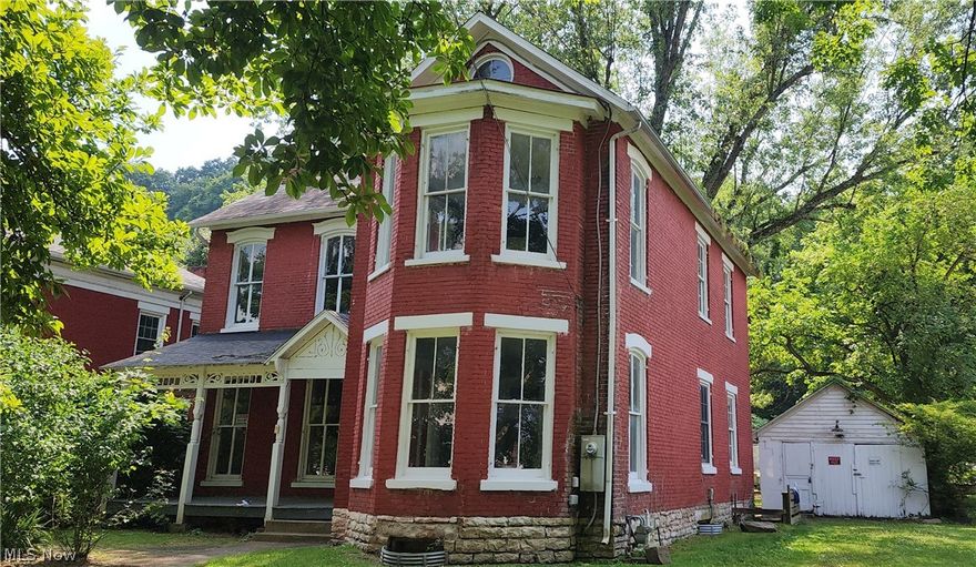 Nestled in an Old Historic Neighborhood is this 2468 Square Foot Residence Containing 9 Rooms,  3 to 5 Bedrooms, 2 Full Baths, Formal Dining Room, & Parlor. Large Rear Yard and Detached Garage. Home Has had many Recent updates including 200 Amp Electric Upgrade, Furnace, Windows, Refinished original wood flooring, Some of the Wiring, Plumbing, Plaster Work, Painting and Much More. The Kitchen Has Been Expanded in recent Years to be a Large Inviting Light and Bright Gathering Place. Both Baths have been updated Keeping the Historic Look and Features. The Home Has the 10 foot Ceilings Typical of the Era and and The Formal Parlor (Living Room and the Master Above Boast the Expanded Bay Design Flooding the Rooms With Extra Light ).  This Classy Architecture Feature Sets this Historic Residence apart from the Other Residences in the Area.  If you are looking for an Historic Home This is a Must See! $500 earnest money and preapproval letter required for all offers. Cash and conventional financing offers only