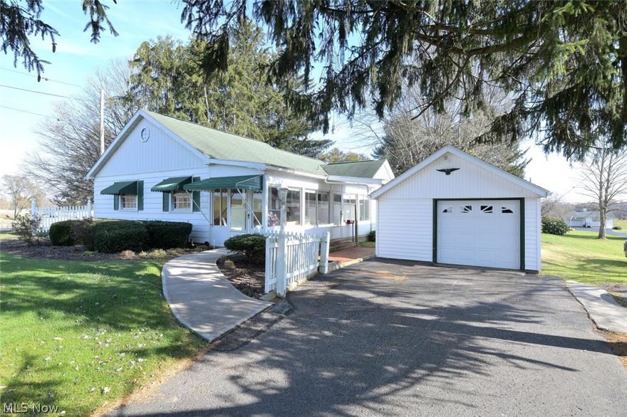 This home offers a private front porch , large living room, 2 bedrooms  1 and a half baths , 1 car garage