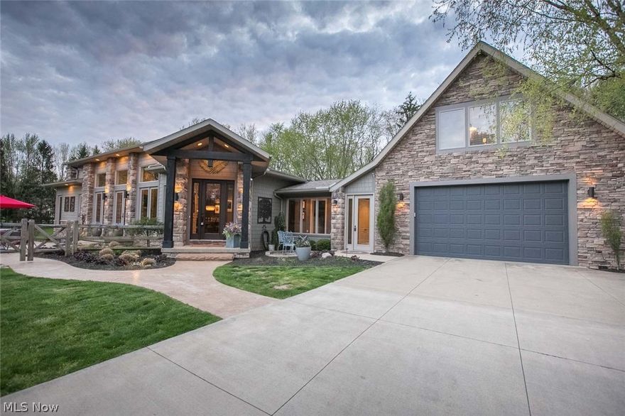 Rare opportunity in Bath!  Open concept KNL built, exquisite home on one of a kind, pristine property in Bath.  The wooden split rail fence-lined property offers over 5.3 acres of privacy and beauty.  Mature trees surround this contemporary lodge with tranquil pond and long, winding driveway to nestle you amongst the pine trees.  Exceptional landscaping and outdoor living offer many opportunities to enjoy the natural beauty. No detail was left to the imagination with this custom built home.  Over 3700 sq ft of living space on one of Bath's premier properties located just a mile from Montrose, shopping, dining and access to major highways.  Don't miss out on this rare opportunity.