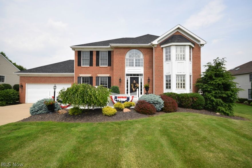 Stately brick front colonial in desirable Hyde Park Estates. Open hardwood foyer. Dramatically-lit gleaming kitchen with breakfast bar which opens to a sunlight-filled dinette.  Open and airy great room with gorgeous fireplace. Private first floor office with hardwood flooring. Formal dining room with elegant wainscoting which opens to a light-infused pillared living room.  Extensive wide moldings and dramatic inset soffit lighting throughout the main level. Elegantly grand master bedroom features a private master bath with oversized jetted soaking tub, double porcelain sinks, and a generous walk-in closet. 

Professionally-finished lower level boasts: a beautifully-inlaid bar (which is also plumbed for a refrigerator), rich oak built-in shelving and cabinetry, along with a gorgeous tiled bath. This spacious living area is perfect for entertaining, movie night, and/or a place to just kick up your feet and relax.

An expansive white-rail deck overlooks a deep and private fenced-in b