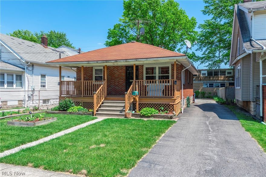 Check out this cute as a button all brick ranch home!  This well maintained home is a pleasure to view.   As you walk up onto the covered front porch, perfect for sitting and relaxing, you enter into the living room.   Off to the one side of the living room is a smaller bedroom.   When you wander further inside you will find a second bedroom and a full bath further down the hall.   Most of the main floor is hardwood or laminate flooring for easy maintenance.  The rear of the home offers the kitchen and dining area and easy access to the extra large wood deck and back yard.  Downstairs you will be pleasantly surprised by the additional 2 bedrooms and family room.   The laundry area and a second full bath complete the lower level.   Plenty of room for entertaining, guest rooms, playroom or what ever you need.    The HVAC is somewhere around 8 years old, with C/A being only 5 yrs old.   Although there is not a garage, there is plenty of room to add one, if desired!