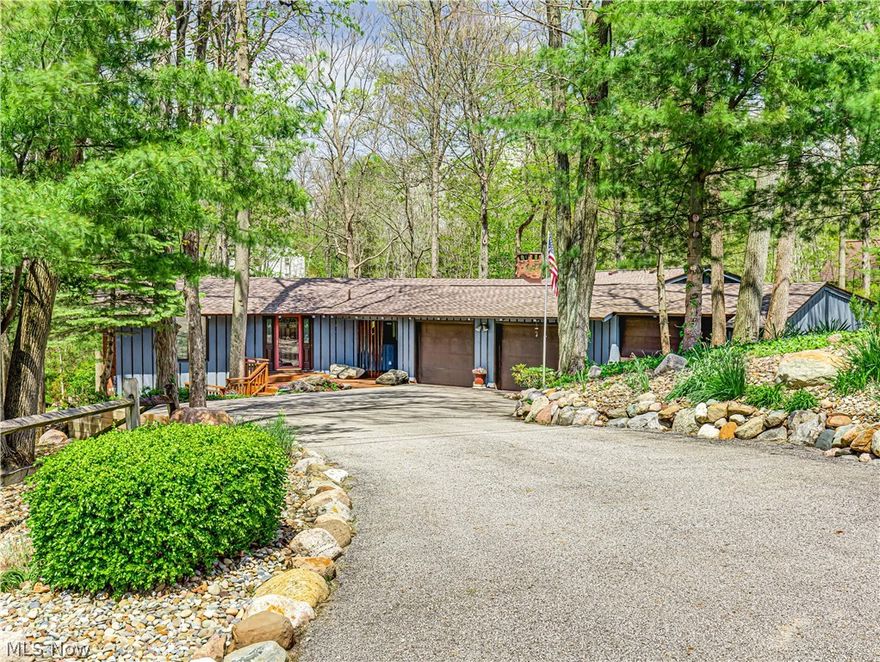 Welcome to Rustic Hills in beautiful Montville Twp/Medina within the Highland LSD! This charming ranch-style home is situated on 1 full acre and offers a perfect blend of privacy and comfort. Surrounded by mature trees and stunning views, this unique property features spacious living areas and classic finishes. This custom-built, one-family home features 5 bedrooms, 2 full baths, and 1 half bath across 2,322 square feet of above-grade living space, along with an additional 1,110 square feet of finished space in the W/O-LL. Step inside and be greeted by beautiful original hardwood floors flowing throughout the spacious formal living and dining rooms, flooded with natural light and featuring soaring cathedral ceilings centered around a stunning stone gas FP. Just off the dining room, you’ll find the large eat-in kitchen featuring classic finishes, abundant natural light, a kitchen island, ample storage, and a second brick gas FP with a dining area. The living room, dining room, and eat-in kitchen each offer their own access to the multi-level back deck overlooking the beautifully maintained backyard and private pond. The upper level is completed by three well-appointed bedrooms, a shared full bath, a half bath, and a mudroom/main-level laundry room. The W/O-LL  offers a spacious family room with a pool table, two additional bedrooms (one featuring WO access and FP) with a shared full bath featuring heated floors, a utility room with walk-out access, two furnaces, and two HTWs, plus a dedicated workshop with shed-style doors and exterior access. Additional highlights include a 4-car attached garage with a total of 6 potential spaces with the tandem garage (33’ x 20’). Recent updates include a fully updated electrical system with 200-amp service; Panels, GFI’s, and circuits (2026), roof (2023), exterior paint (2021), and furnaces and A/C units (2015). Conveniently located near highway access, shopping, and restaurants, this is a one-of-a-kind property. Don’t miss out!